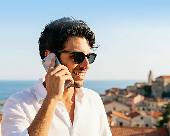 Traveler making a phone call with 7G eSIM abroad